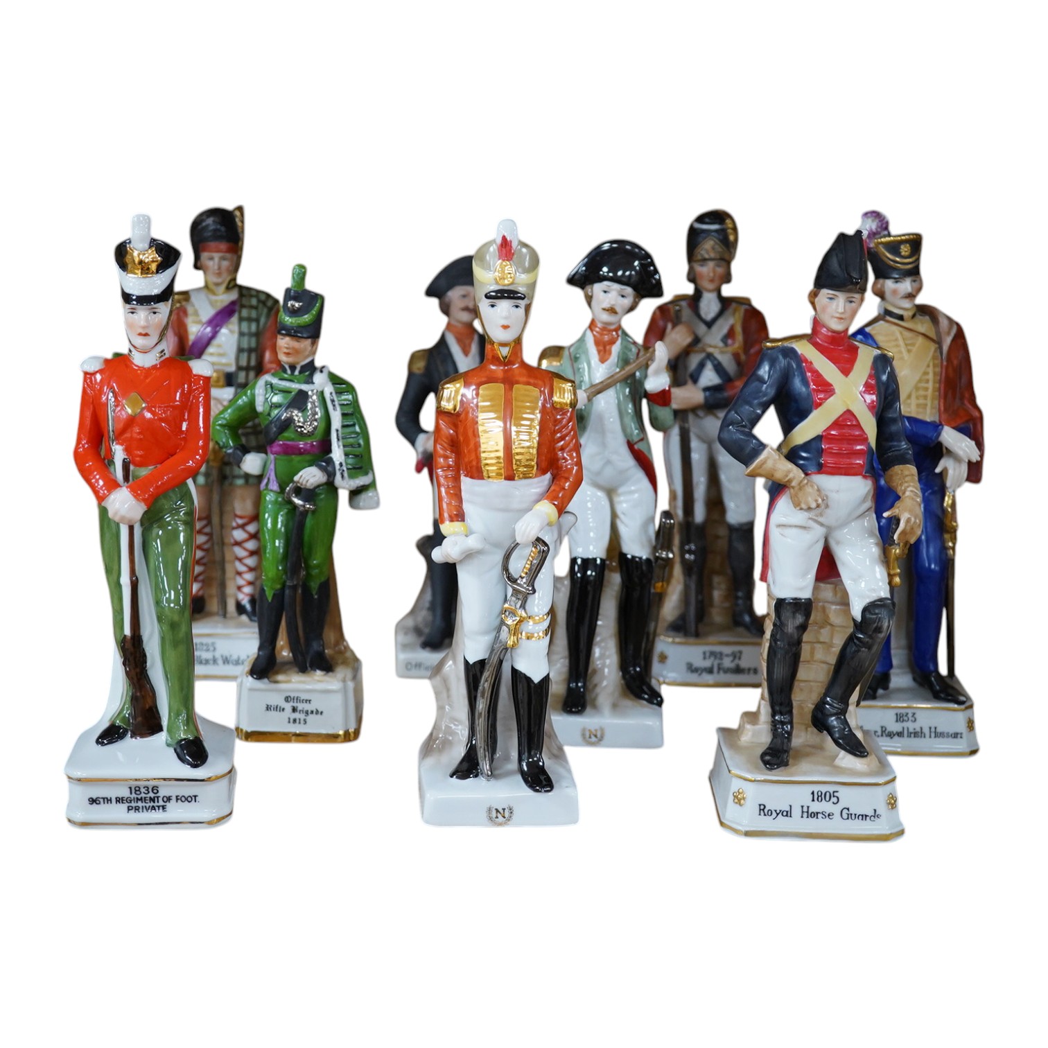 A group of nine various continental porcelain ‘army’ figures. Condition - good